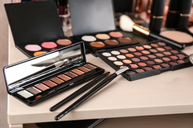 Photo of Set of luxury cosmetics on dressing table