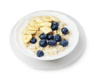 Photo of Tasty oatmeal with banana, blueberries, milk and butter in bowl isolated on white