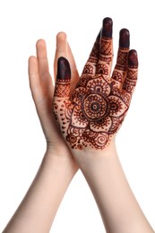 Woman with henna tattoo on palm against white background, closeup. Traditional mehndi ornament