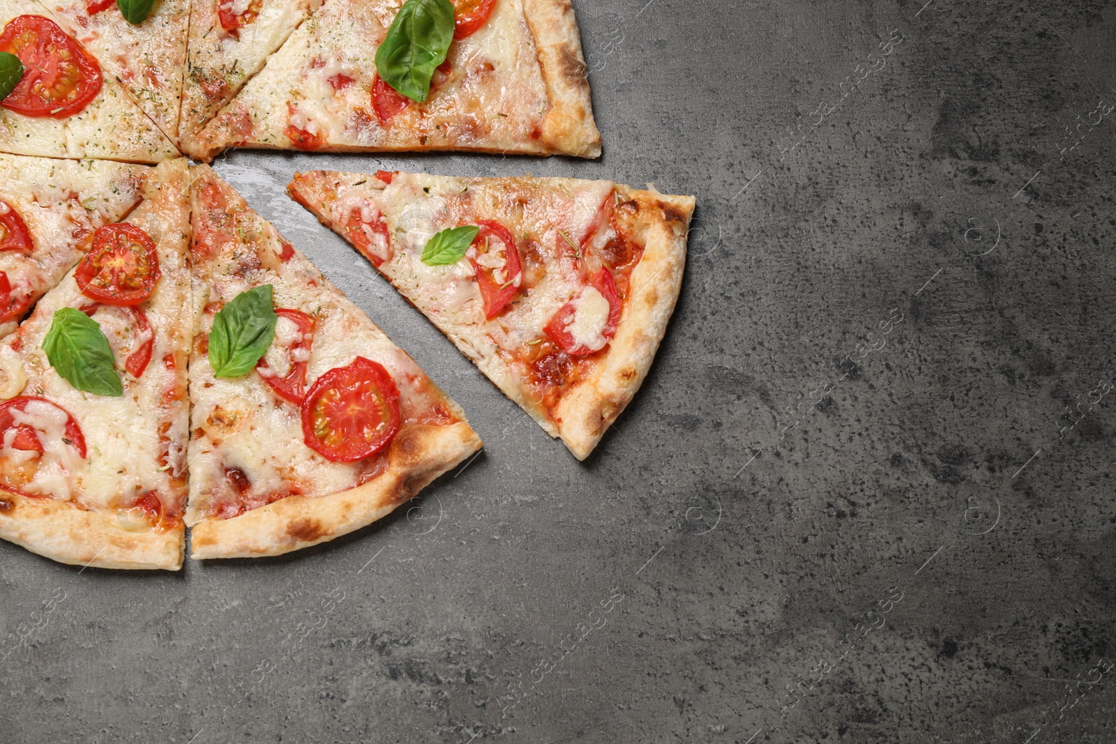 Photo of Delicious pizza Margherita on grey table, flat lay. Space for text