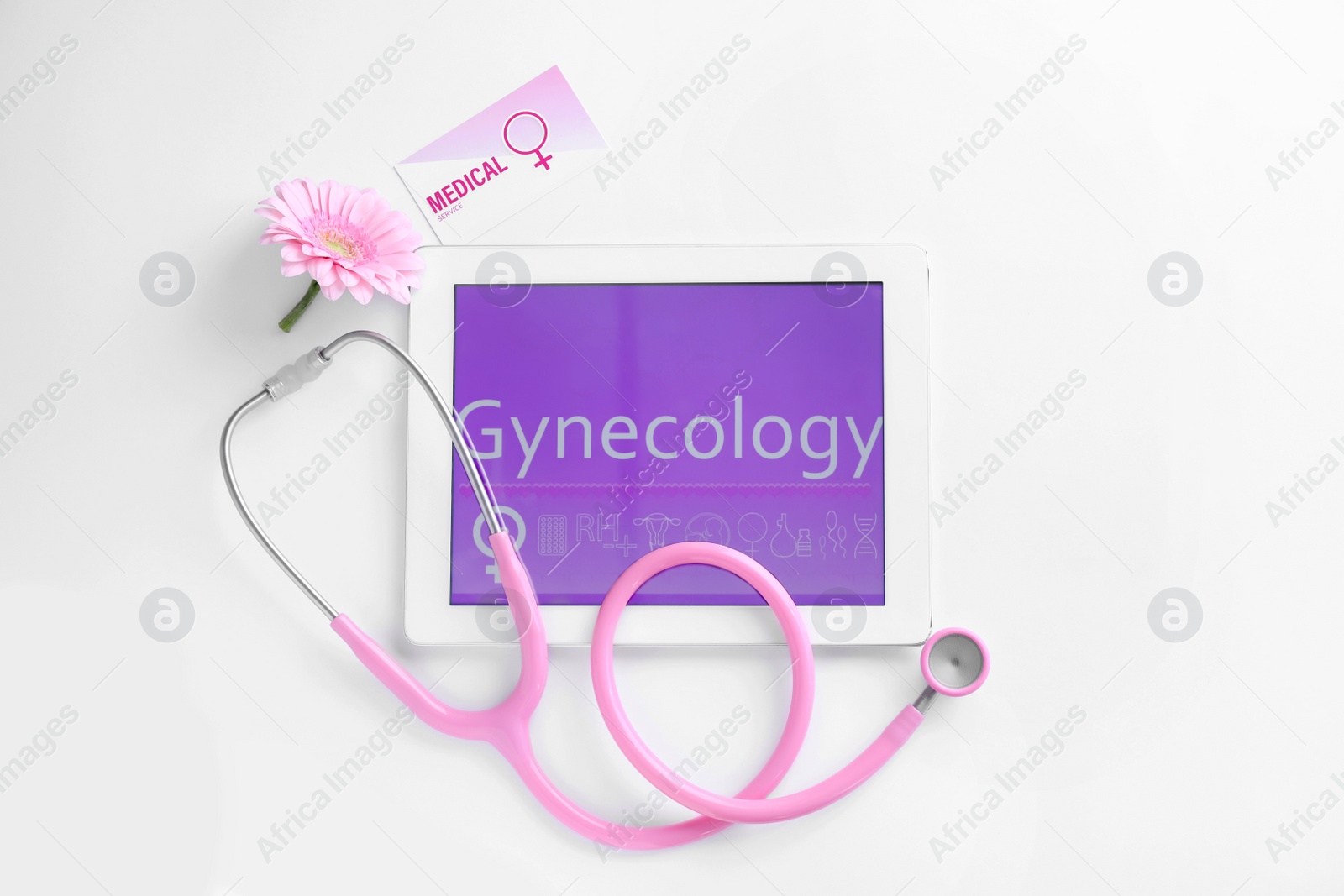 Photo of Tablet and stethoscope on white background, top view. Gynecology concept