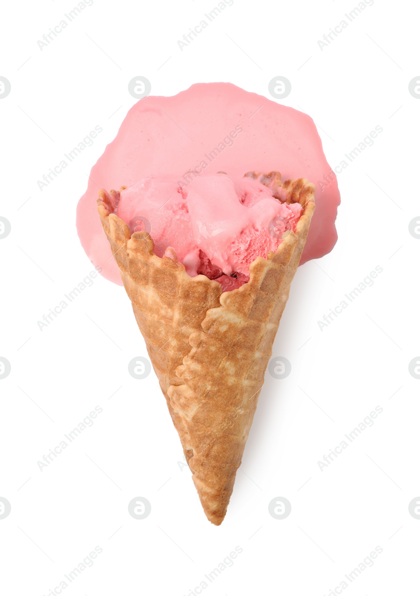Photo of Melting ice cream in wafer cone isolated on white, top view