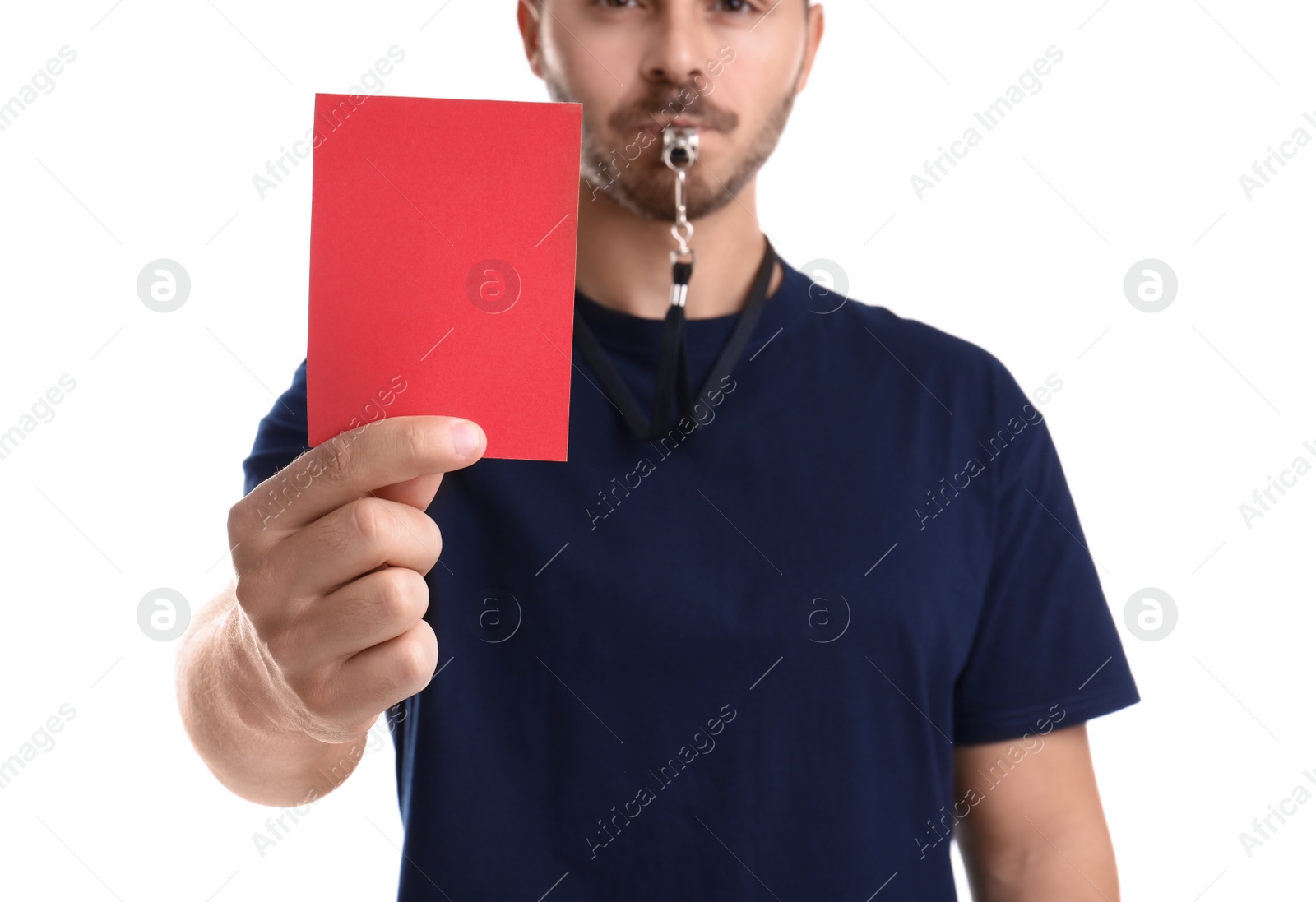 Photo of Football referee with whistle holding red card on white background, closeup