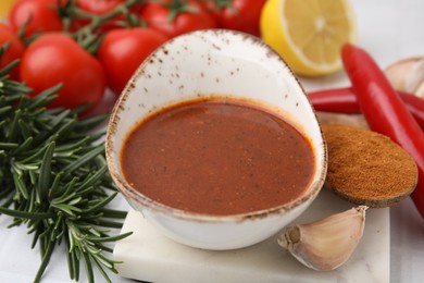 Fresh marinade and ingredients on light table, closeup