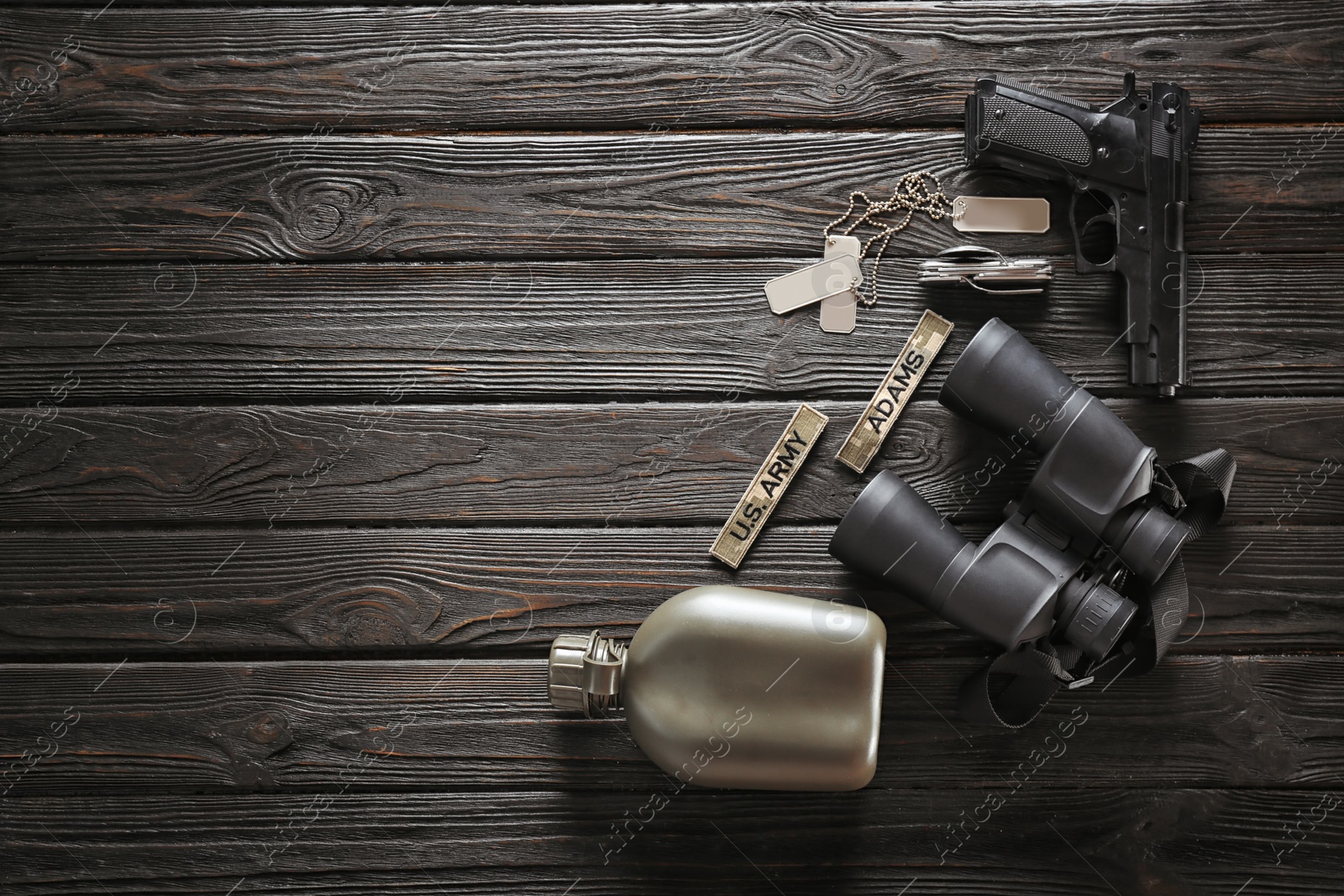 Photo of Set of military outfit on dark wooden background, flat lay