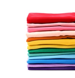 Photo of Stack of colorful t-shirts on white background