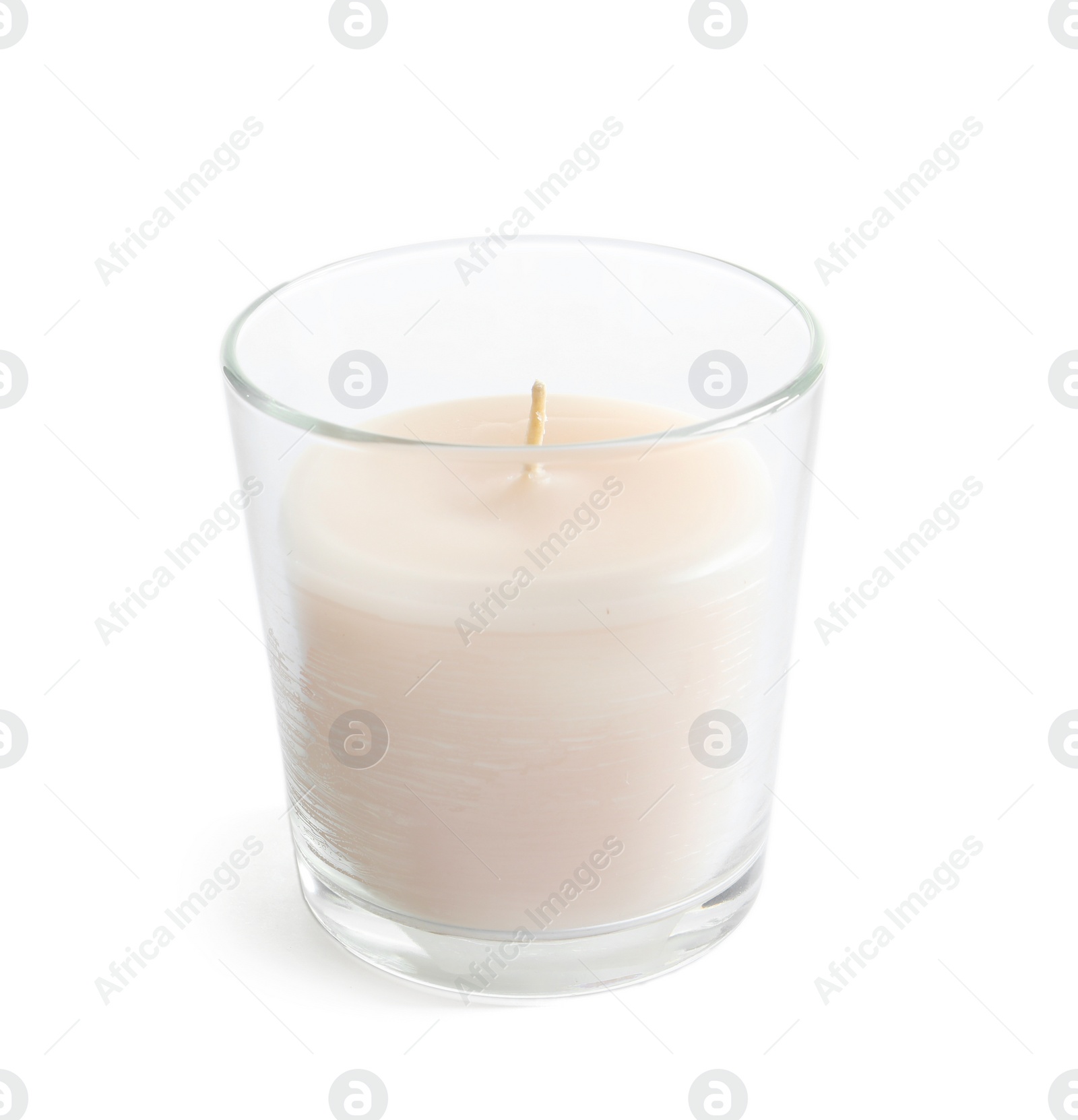 Photo of Glass with wax candle on white background