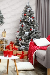 Beautiful decorated Christmas tree in living room interior