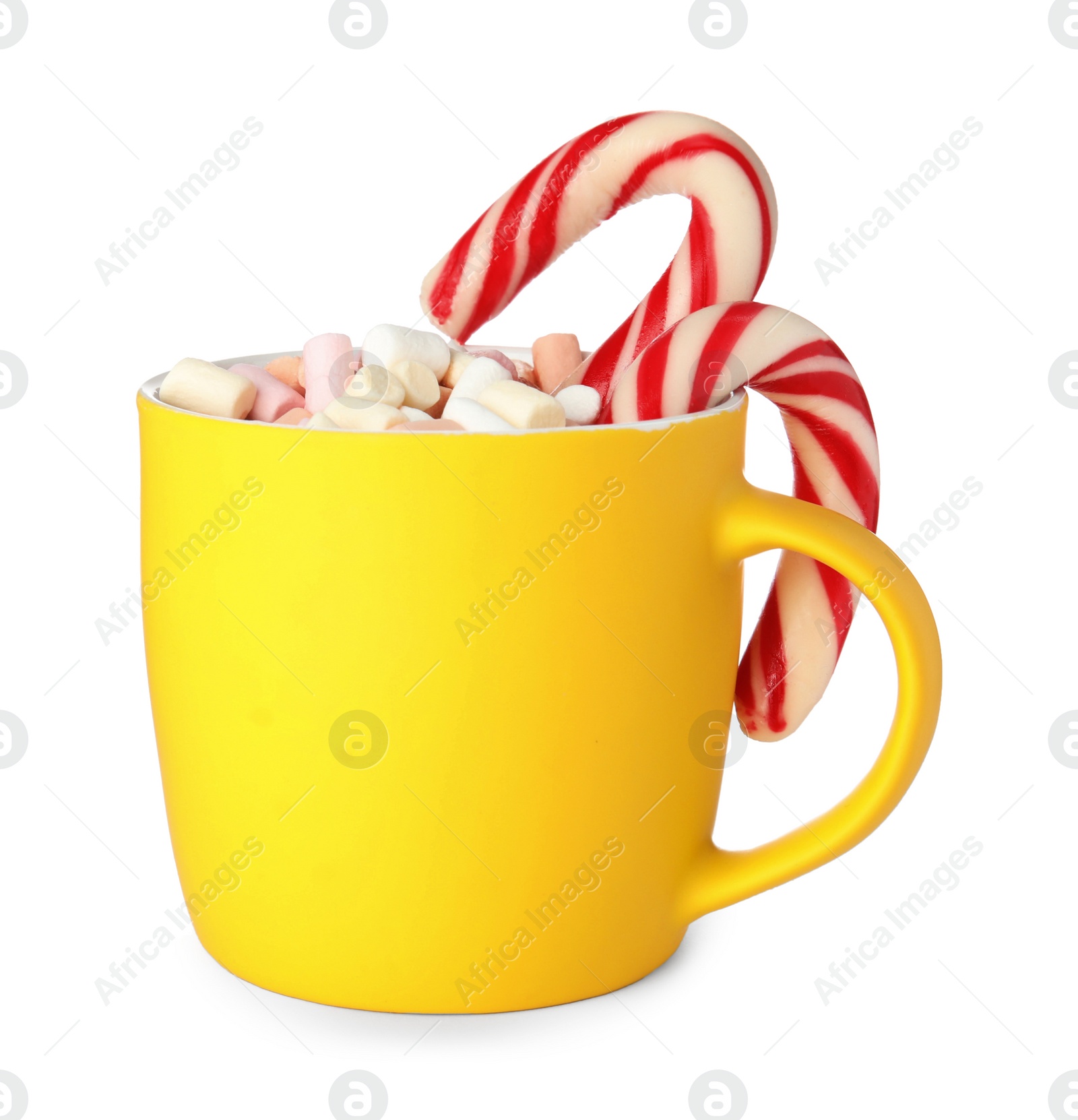 Photo of Cup of tasty cocoa with marshmallows and Christmas candy canes isolated on white