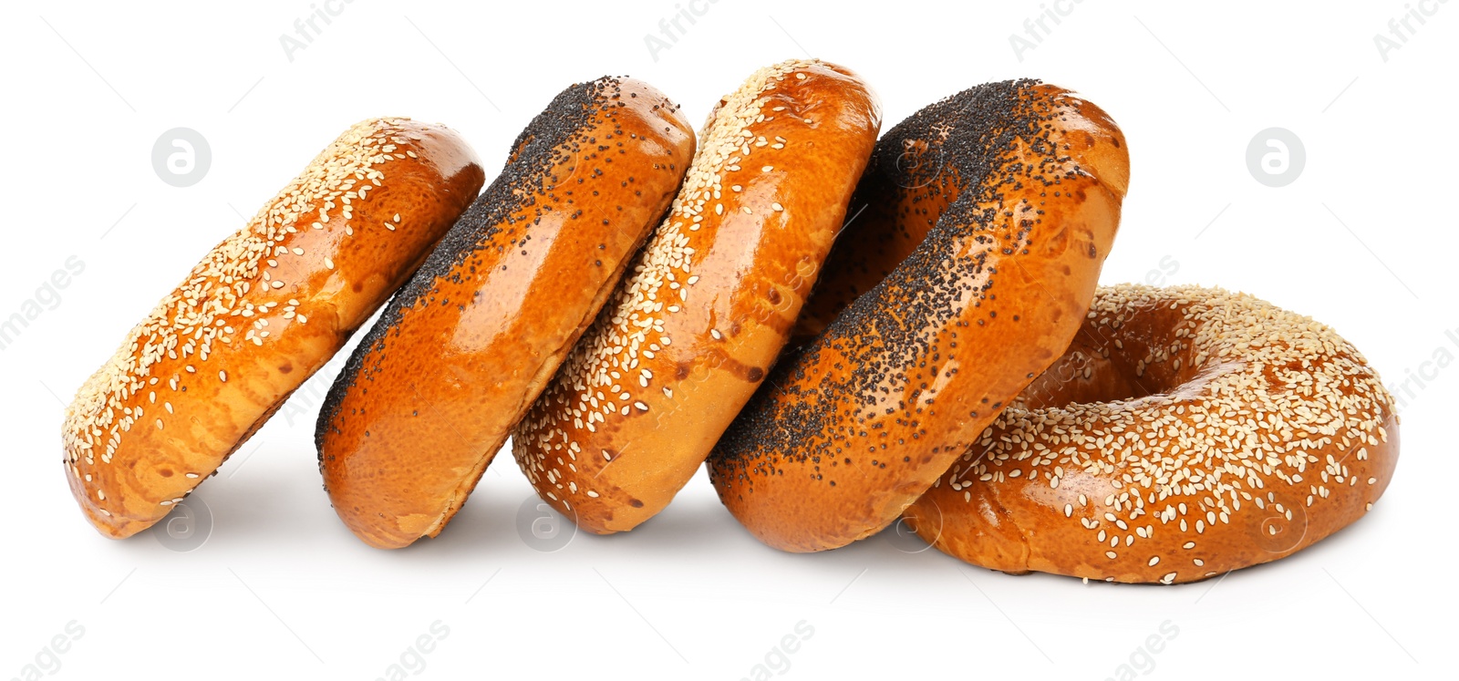 Photo of Many delicious fresh bagels on white background