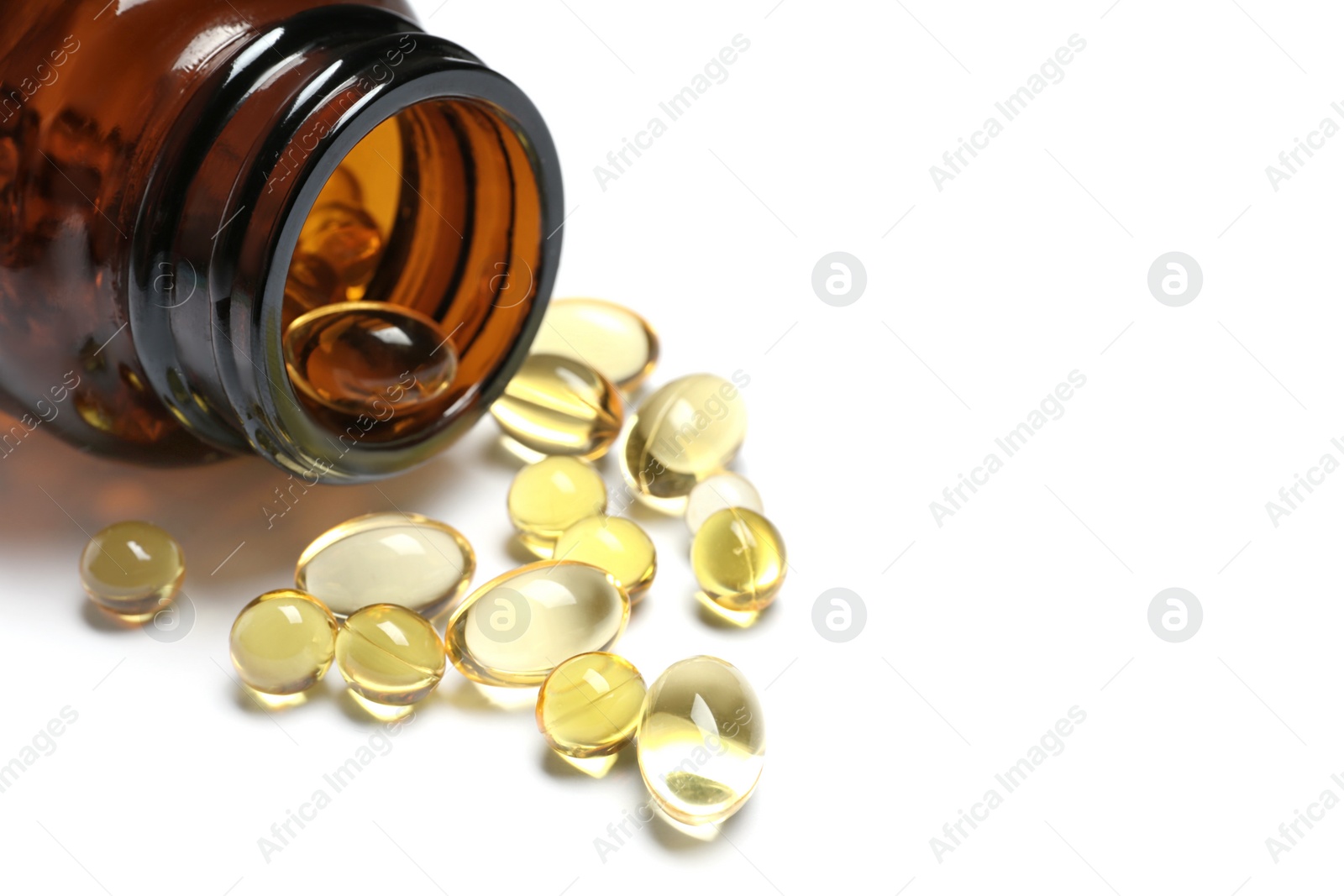 Photo of Bottle with cod liver oil capsules on white background, closeup