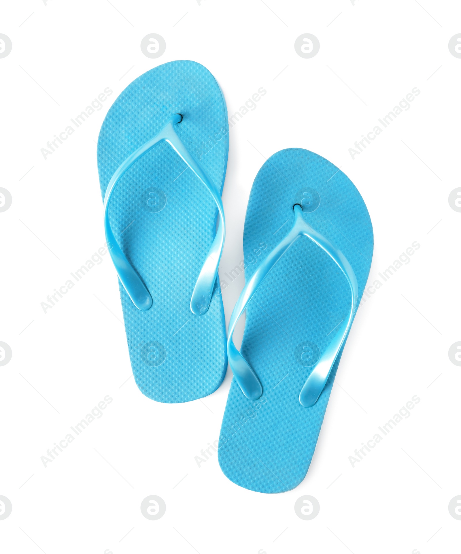 Photo of Bright flip flops on white background. Beach object