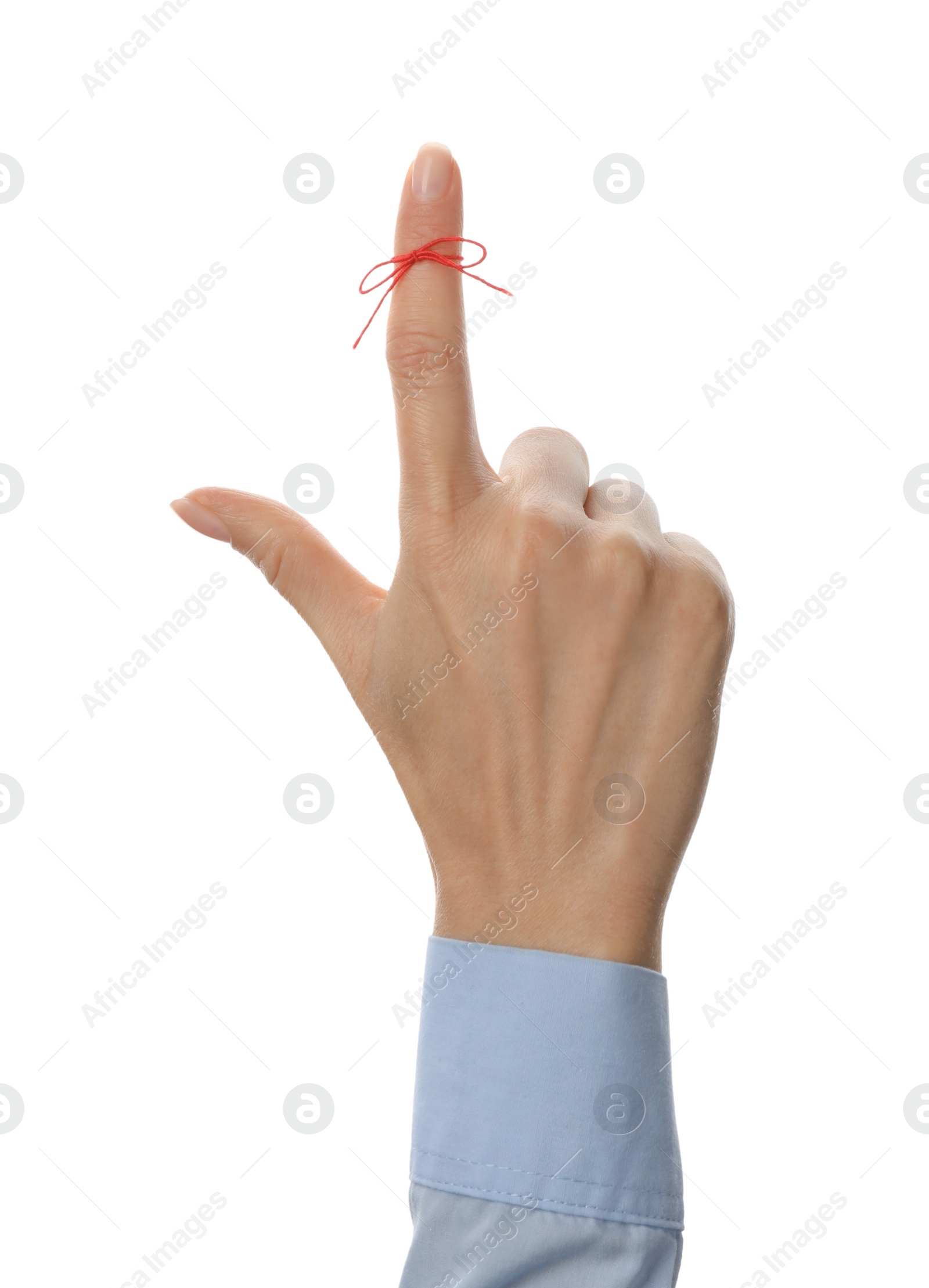 Photo of Woman showing index finger with tied red bow as reminder on white background, closeup