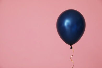 Photo of Bright balloon on color background, space for text. Celebration time