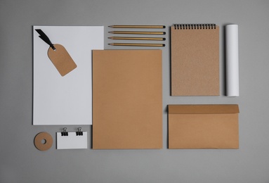 Flat lay composition with stationery on grey background. Mock up for design