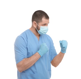 Photo of Doctor with protective mask in fighting pose on white background. Strong immunity concept