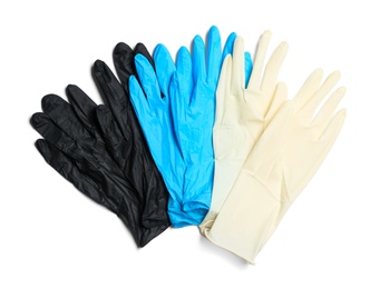 Photo of Different medical gloves on white background, top view