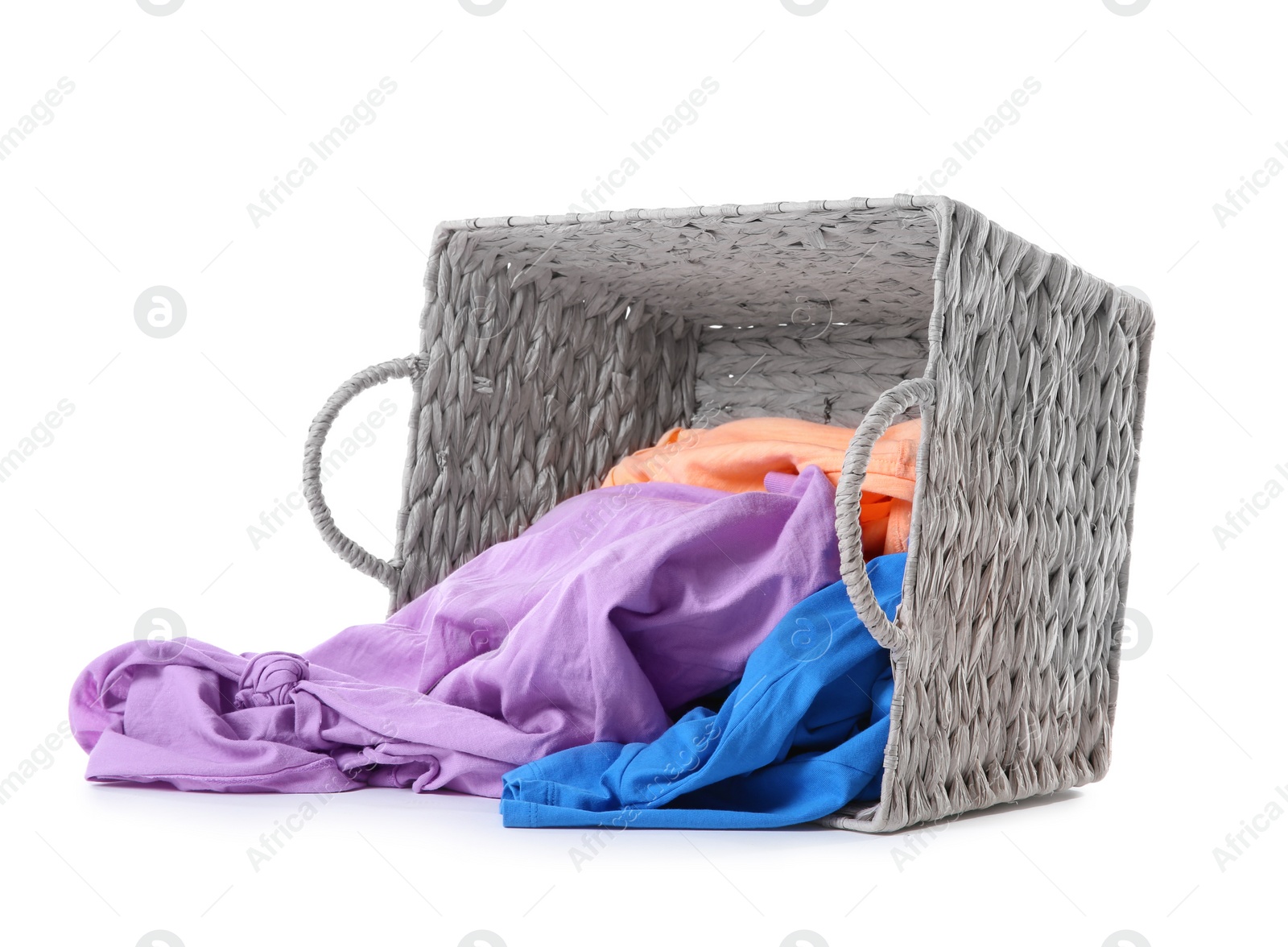 Photo of Laundry basket with scattered dirty clothes isolated on white