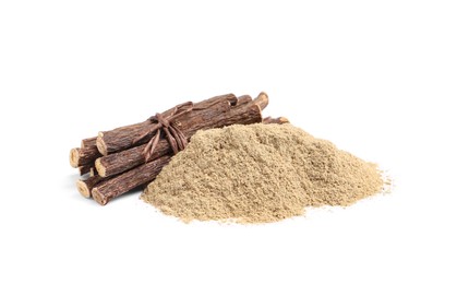 Photo of Dried sticks of liquorice root and powder on white background