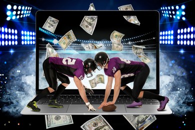 Image of Sports betting. Men in uniform playin American football on laptop under stadium lights. Money flying through device