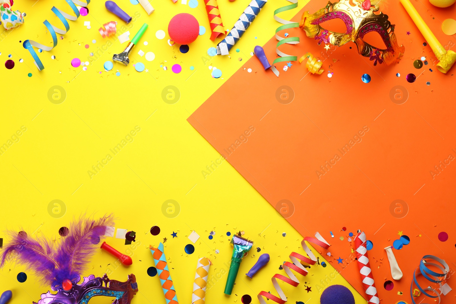 Photo of Flat lay composition with carnival items on color background. Space for text