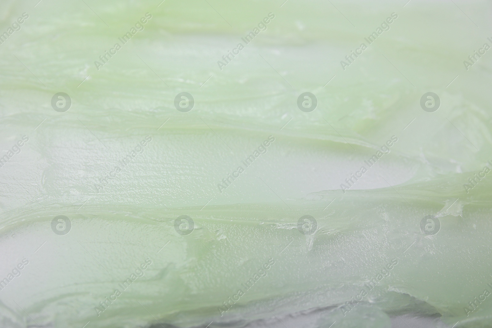 Photo of Texture of cosmetic petrolatum as background, closeup view