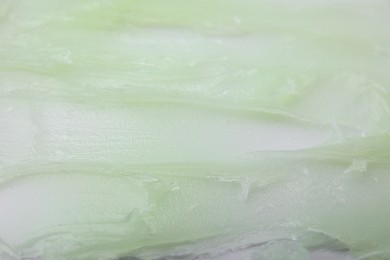 Photo of Texture of cosmetic petrolatum as background, closeup view