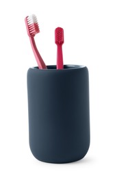 Photo of Bath accessories. Toothbrushes in dark blue holder isolated on white