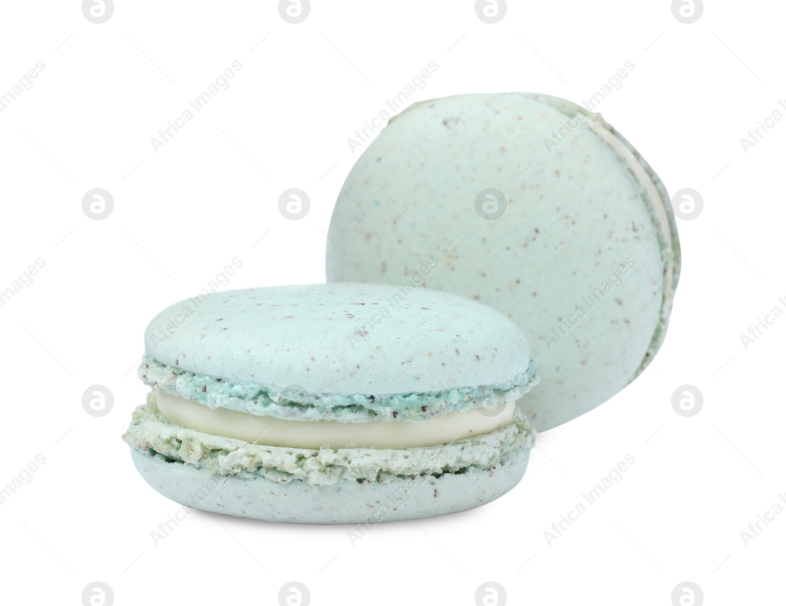 Photo of Light blue macarons on white background. Delicious dessert