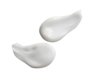 Photo of Samplesfacial cream on white background, top view