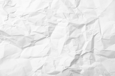 Sheet of white crumpled paper as background, closeup