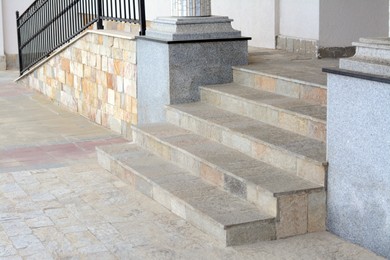 Photo of View of stone outdoor stairs with ramp