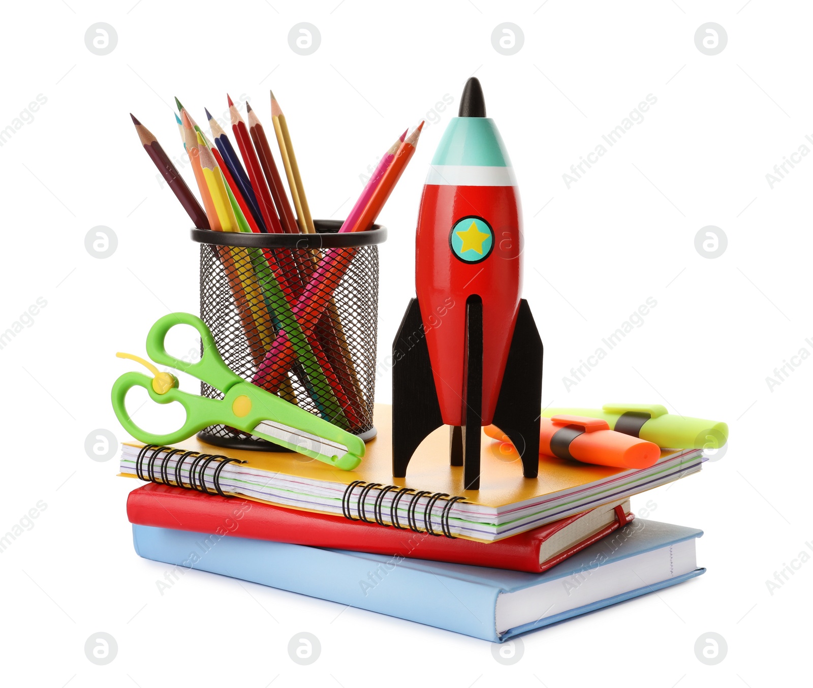 Photo of Bright toy rocket and school supplies on white background