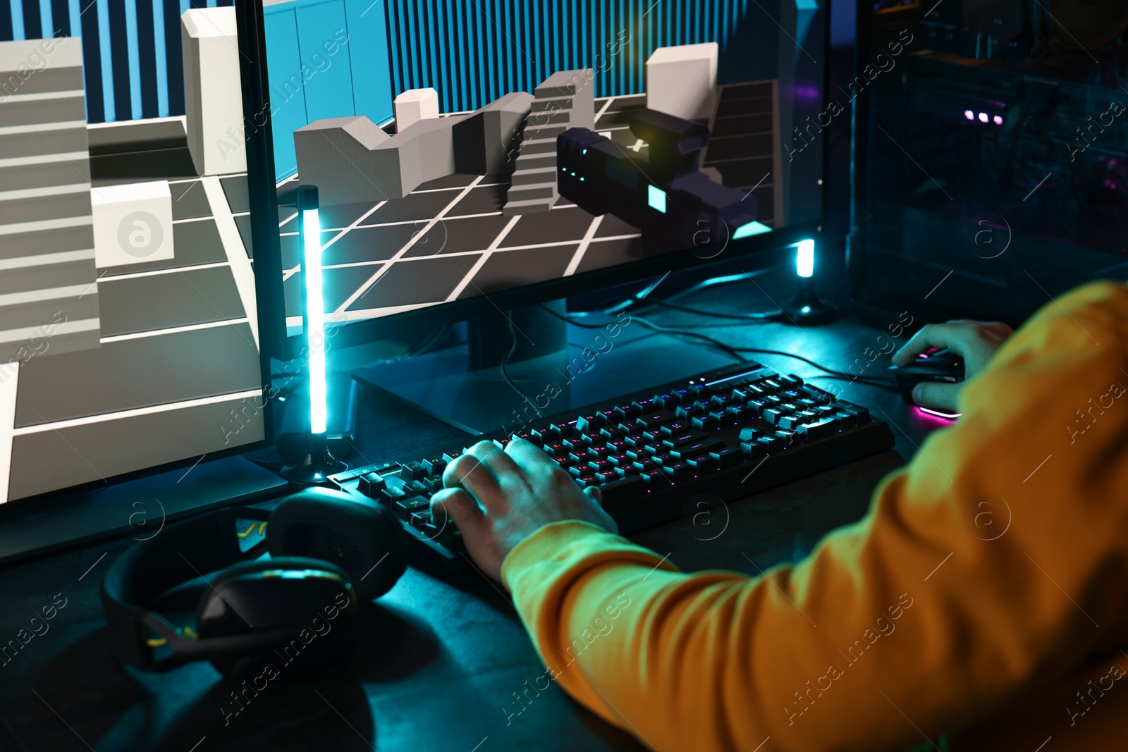 Photo of Man playing video games on computer indoors, closeup