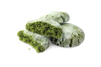 Tasty whole and broken matcha cookies on white background