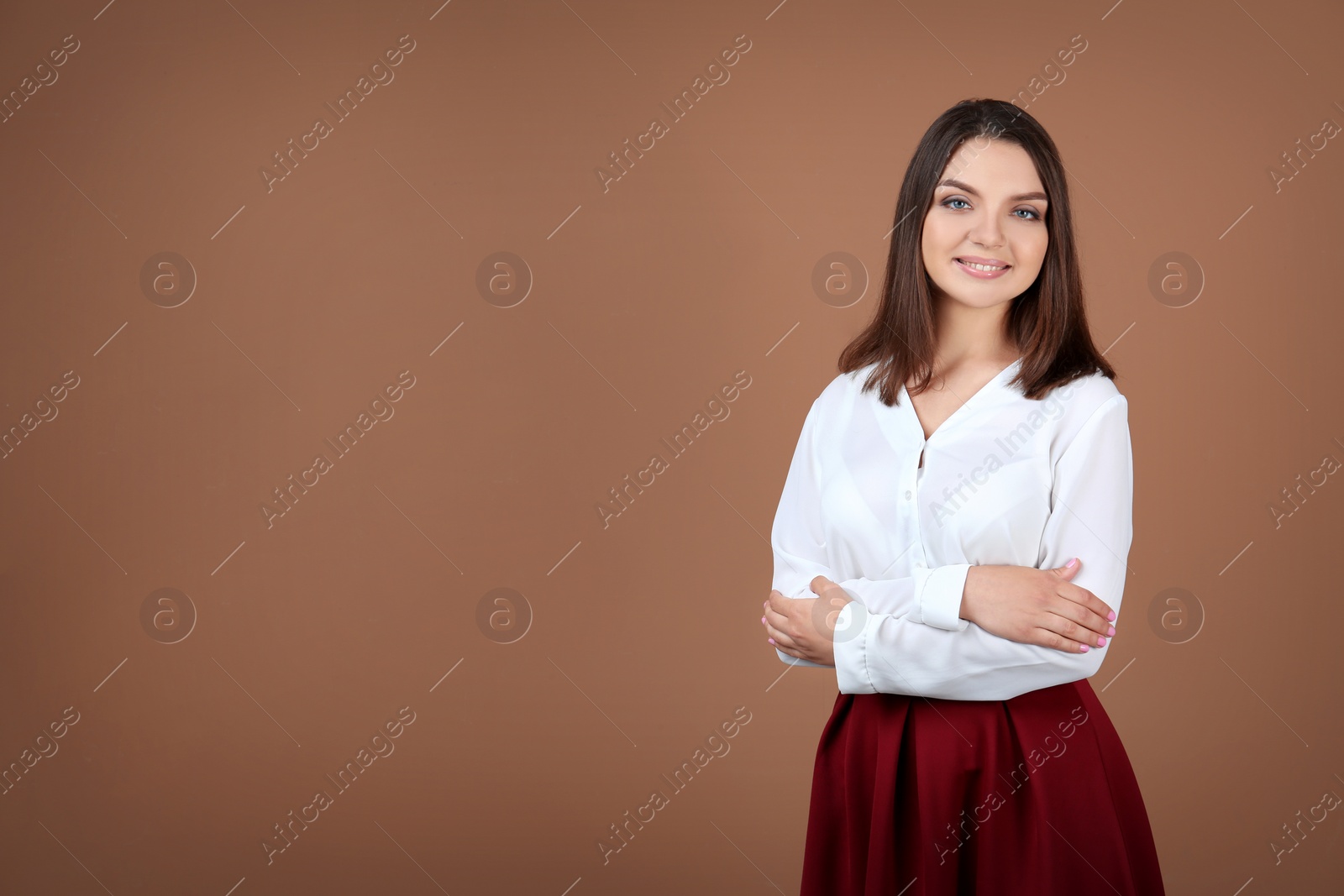 Photo of Portrait of young woman in stylish outfit on color background