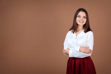 Photo of Portrait of young woman in stylish outfit on color background