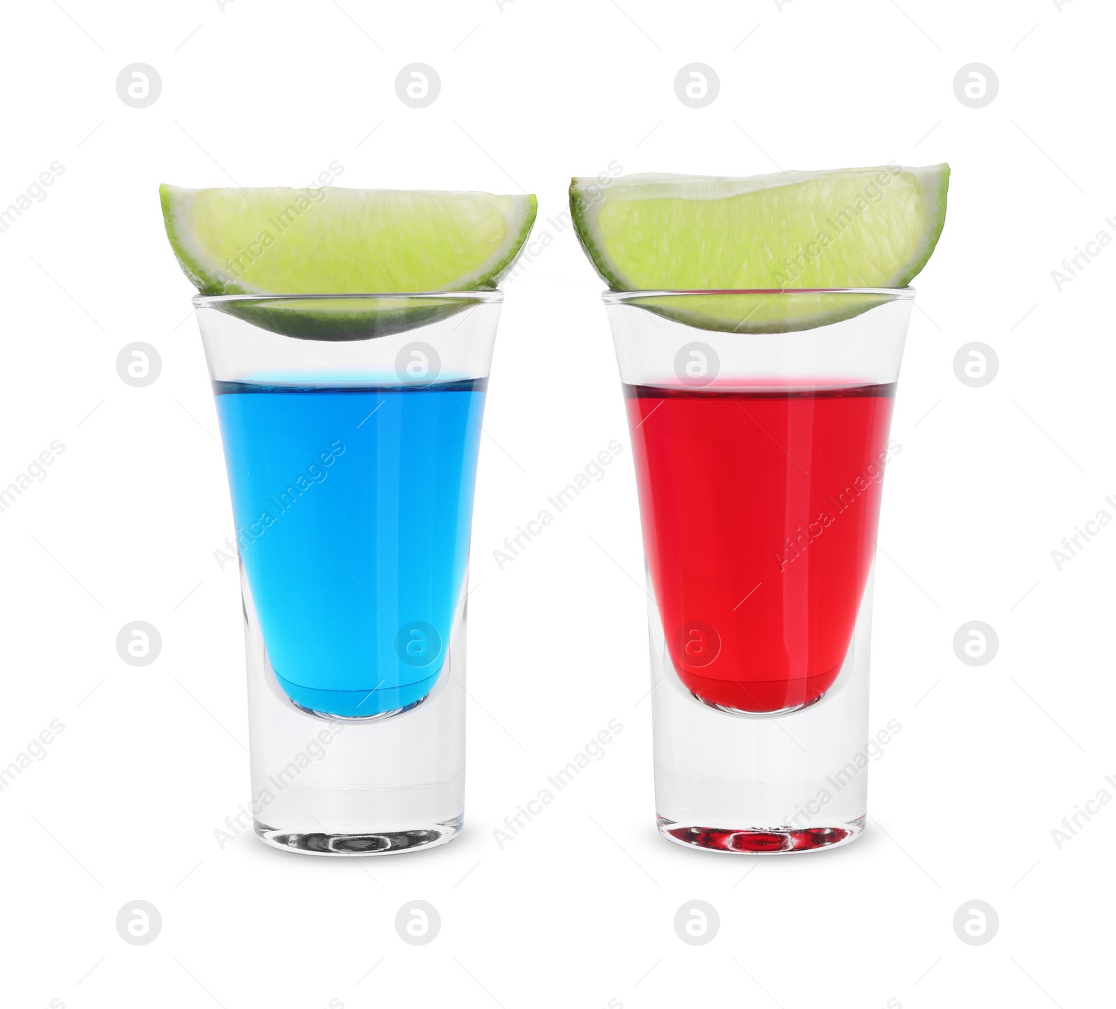 Photo of Different shooters in shot glasses and lime wedges isolated on white. Alcohol drink