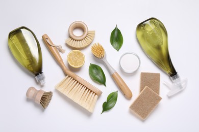 Flat lay composition with different cleaning supplies on white background