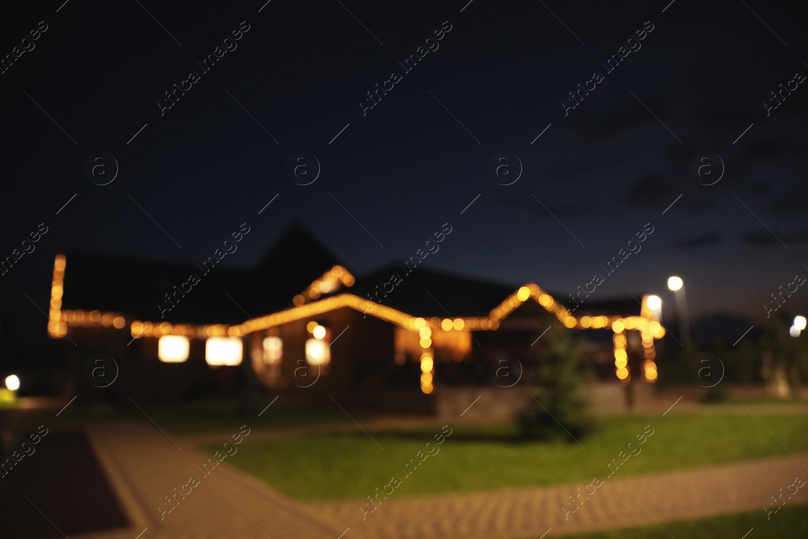 Photo of Blurred view of house decorated with glowing lights