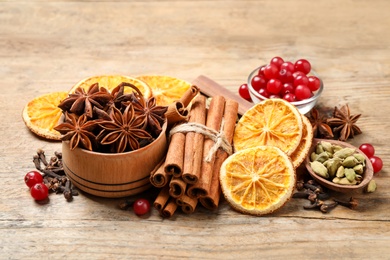 Photo of Composition with mulled wine ingredients on wooden table