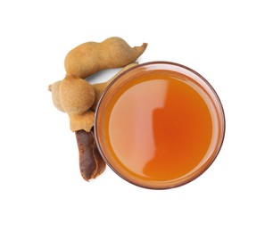 Glass of tamarind juice and fresh fruits isolated on white, top view