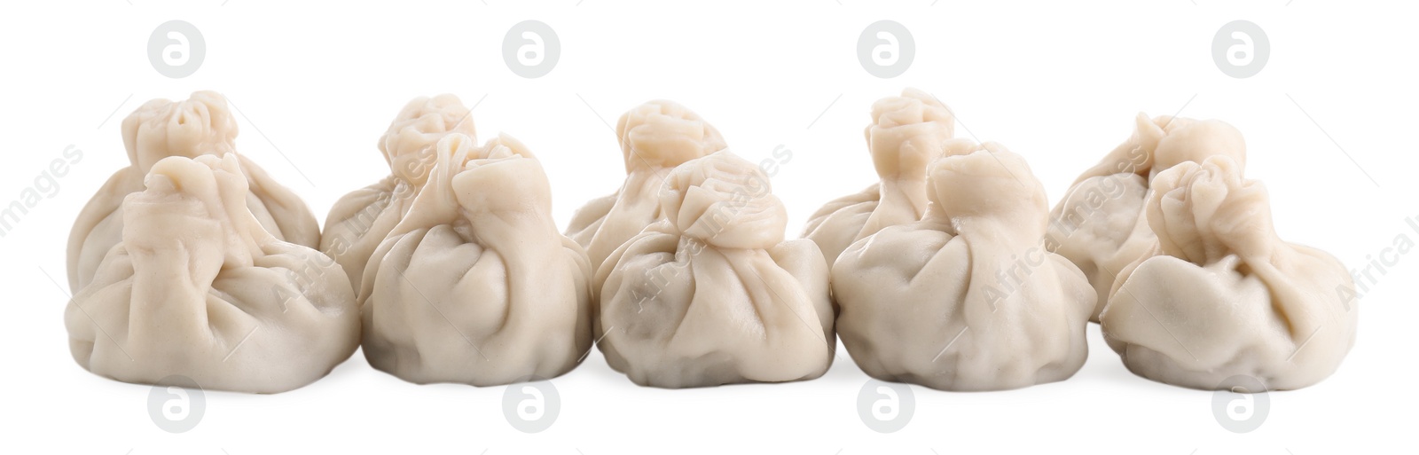 Photo of Many tasty khinkali (dumplings) isolated on white. Georgian cuisine