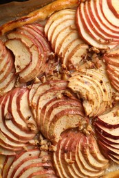 Photo of Closeup view of fresh apple galette with nuts