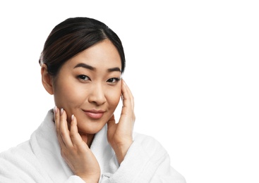 Photo of Portrait of beautiful Asian woman in bathrobe isolated on white. Spa treatment