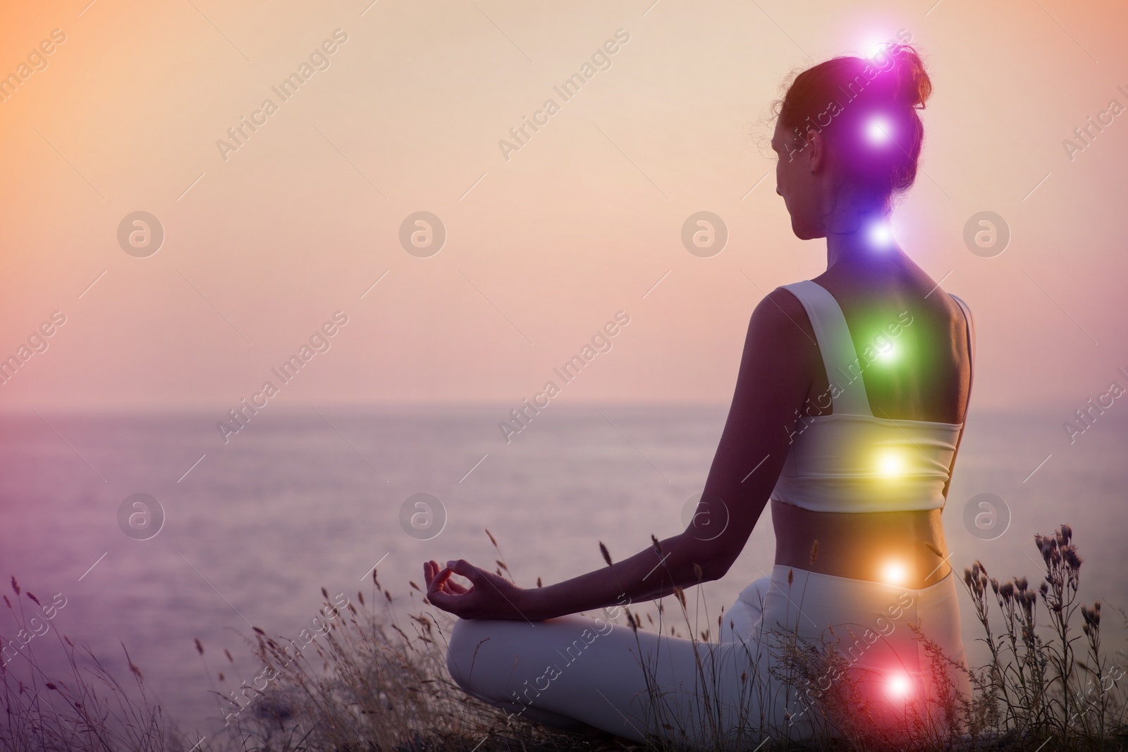 Image of Woman meditating near sea. Scheme of seven chakras, illustration