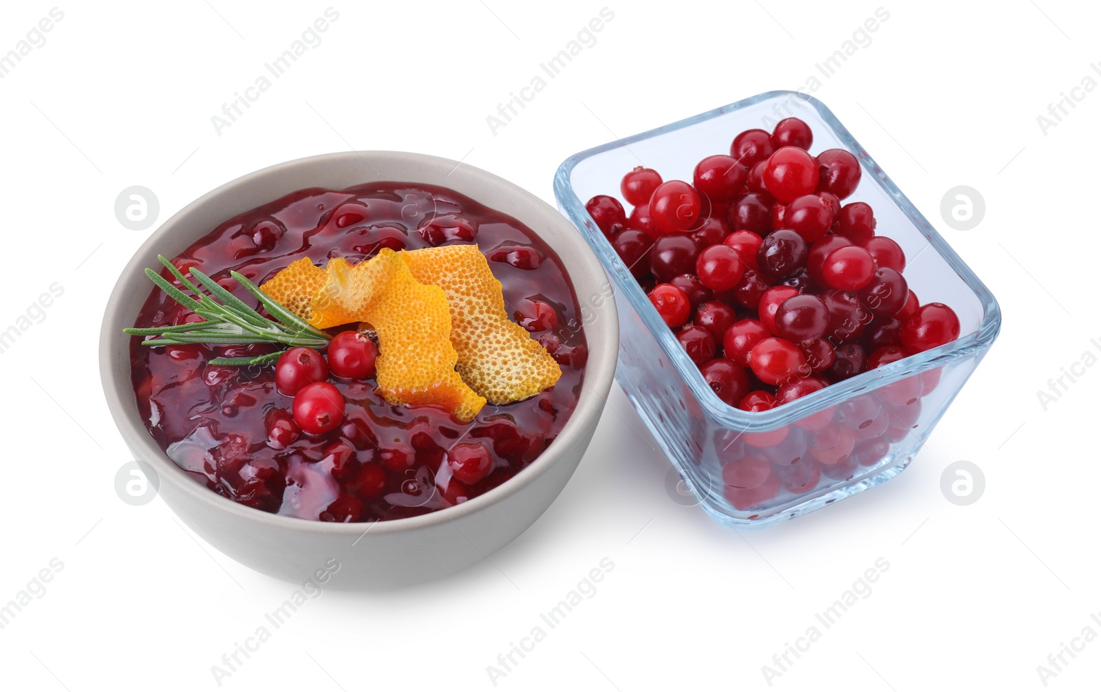 Photo of Fresh cranberry sauce, rosemary, berries and orange peel isolated on white