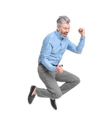 Photo of Mature businessman in stylish clothes jumping on white background