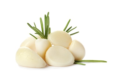 Photo of Preserved garlic with rosemary on white background