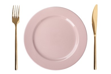 Empty pink plate with golden fork and knife on white background, top view